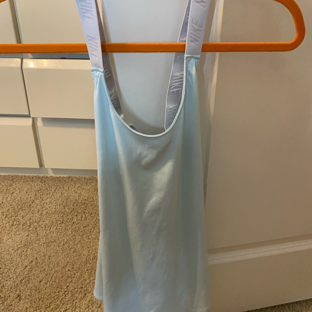 XS turquoise Nike tank top, cross back.